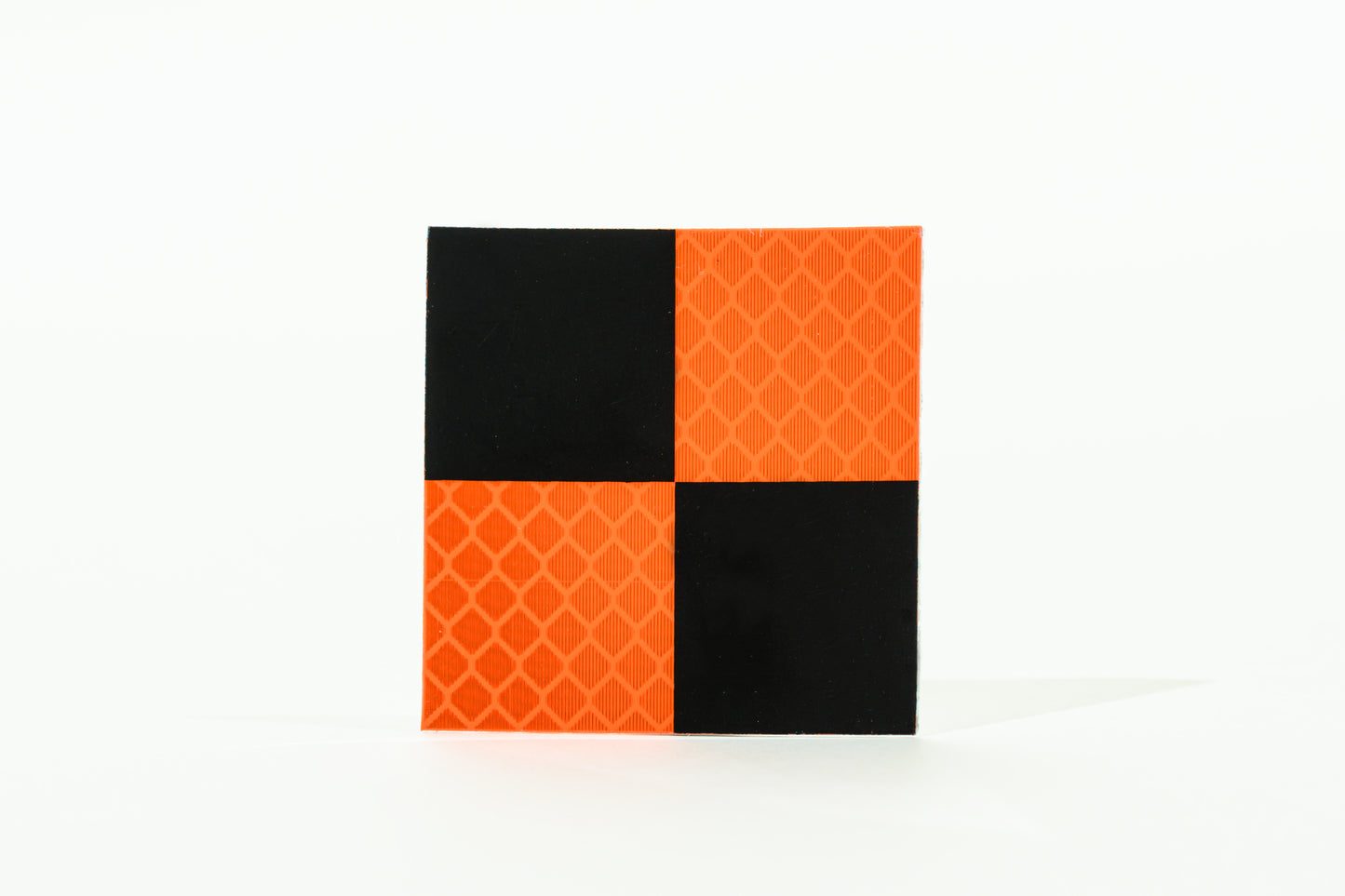 <transcy>Orange and black reflective target</transcy>